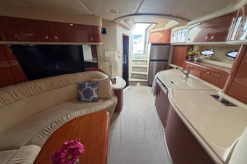 Slide: The Image of Luxurious interior of 1998 Sea Ray Sundancer 540 yacht with elegant seating and modern kitchen. - 18