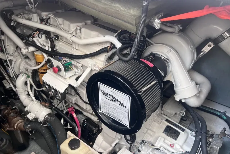 Slide: The Image of Engine compartment of a 1998 Sea Ray Sundancer 540 yacht, showcasing detailed mechanical components. - 43