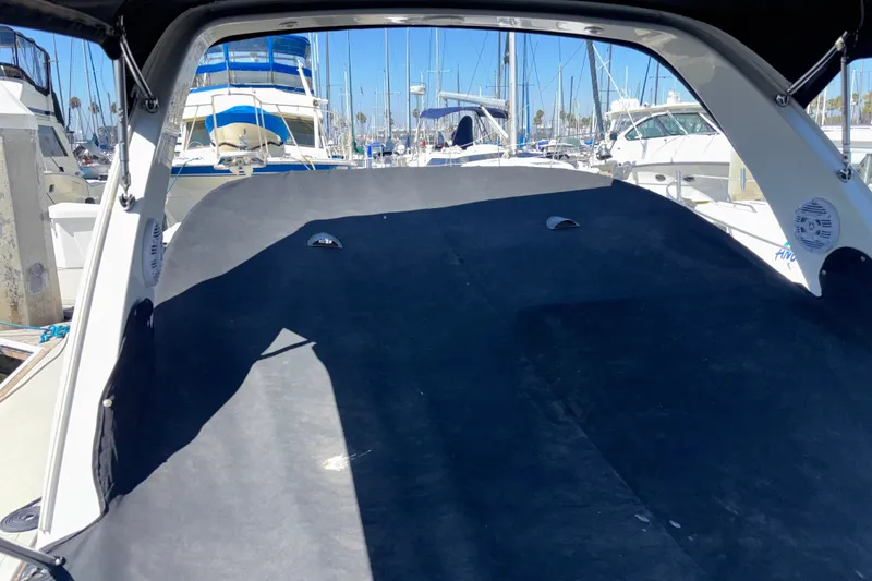 Slide: The Image of Interior view of a 2016 Sea Ray Sundancer 260 boat docked at a marina. - 22