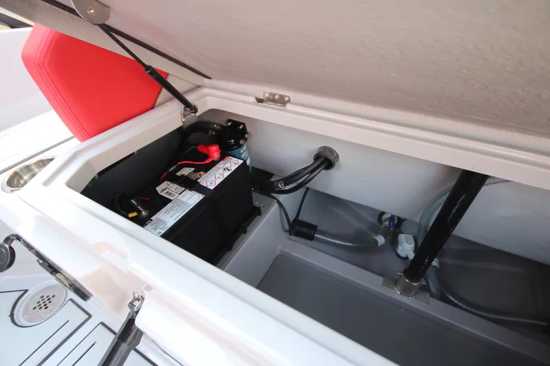 Slide: The Image of Battery compartment of 2027 IRON BOATS 707 T-top with red seat and wiring. - 16