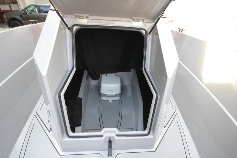 Slide: The Image of Interior view of 2027 IRON BOATS 707 T-top cabin with compact toilet. - 26