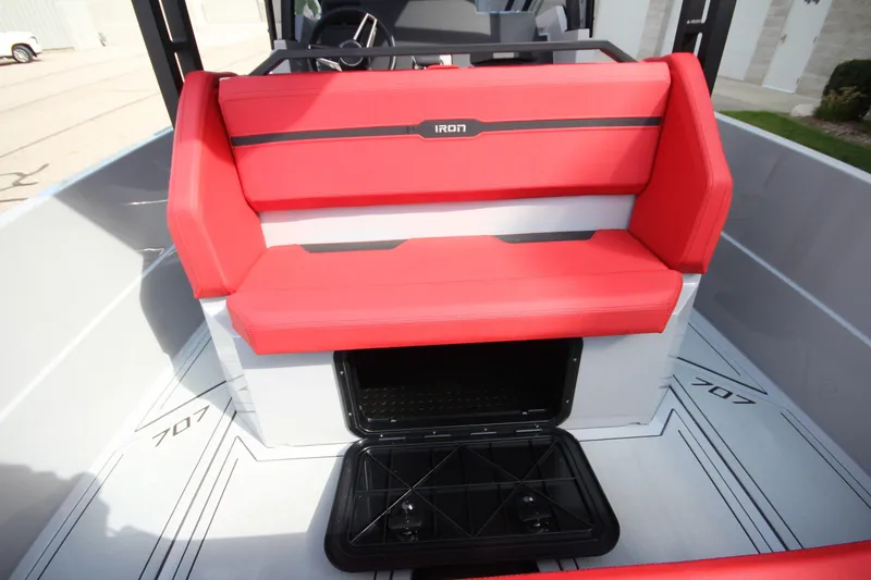 Slide: The Image of Red seating on 2027 IRON BOATS 707 T-top with storage compartment open. - 18
