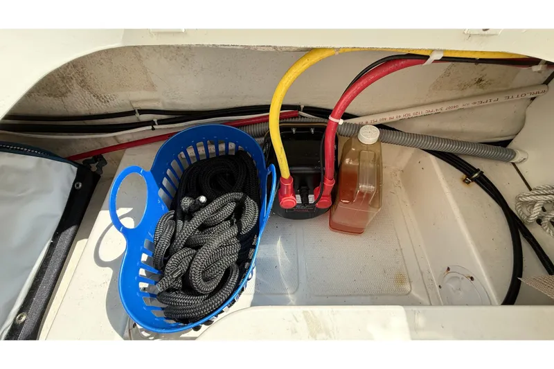 Slide: The Image of Storage compartment of a 2012 American Tug 365 with ropes and cables. - 42