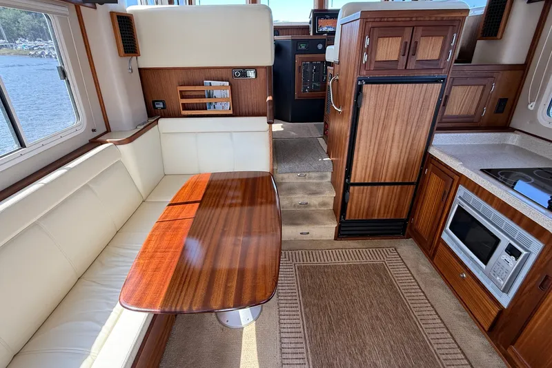 Slide: The Image of Interior of 2012 American Tug 365 with wood finishes and modern amenities. - 60