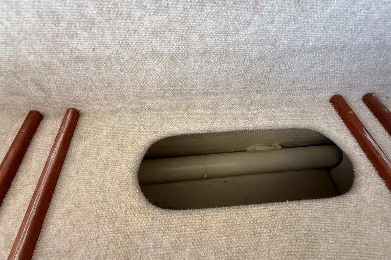 Slide: The Image of Interior view of 2012 American Tug 365, showing carpeted surface and wooden trim. - 75