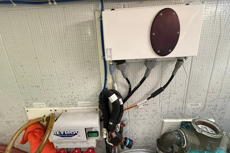 Slide: The Image of Engine room of 2012 American Tug 365 with Reverso oil change system and wiring. - 23