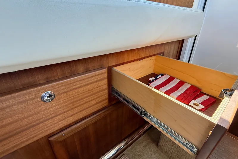 Slide: The Image of Open drawer in 2012 American Tug 365 with folded American flag inside. - 102