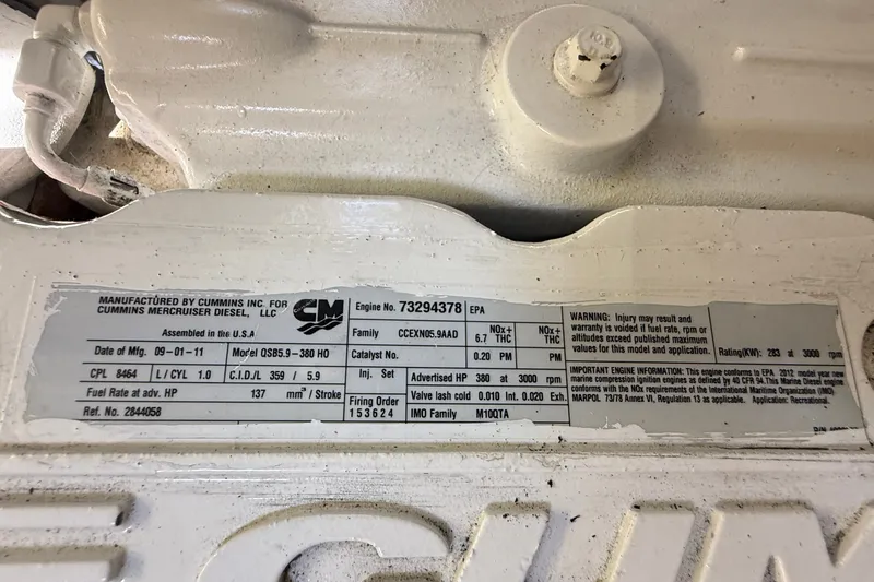 Slide: The Image of Engine label on a 2012 American Tug 365, Cummins Mercruiser Diesel specifications. - 27