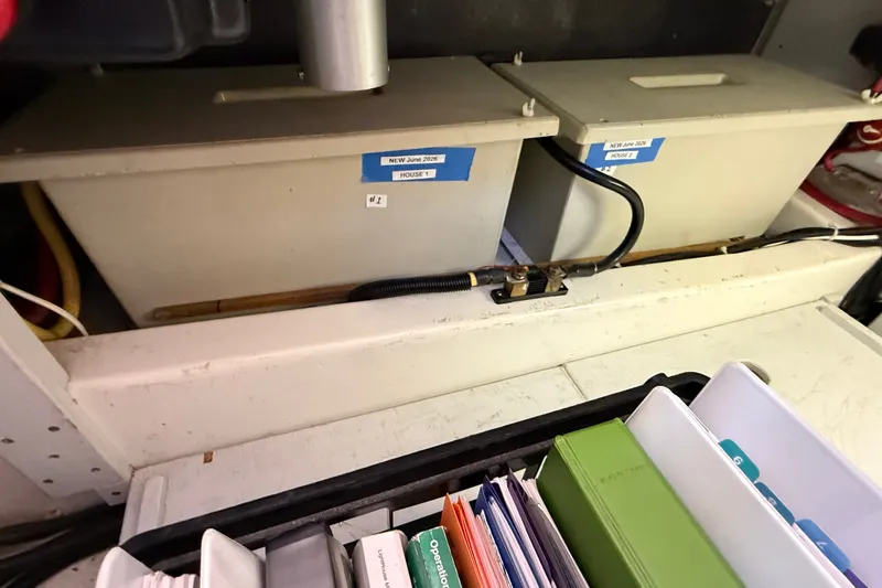 Slide: The Image of Battery compartment of a 2012 American Tug 365 with labeled storage boxes. - 67