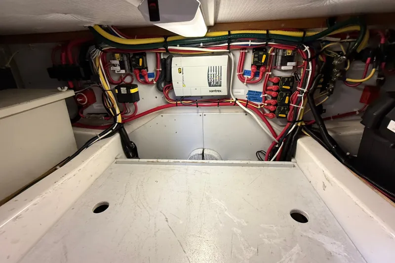 Slide: The Image of Electrical system of a 2012 American Tug 365, featuring wiring and components. - 69