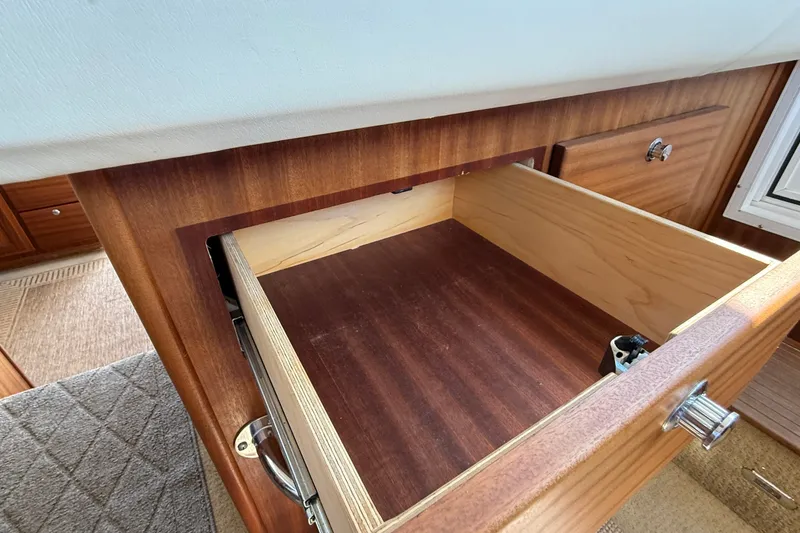 Slide: The Image of Open wooden drawer inside a 2012 American Tug 365 boat interior. - 101
