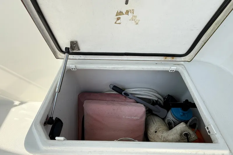 Slide: The Image of Storage compartment on a 2012 American Tug 365 boat, containing marine equipment and supplies. - 36