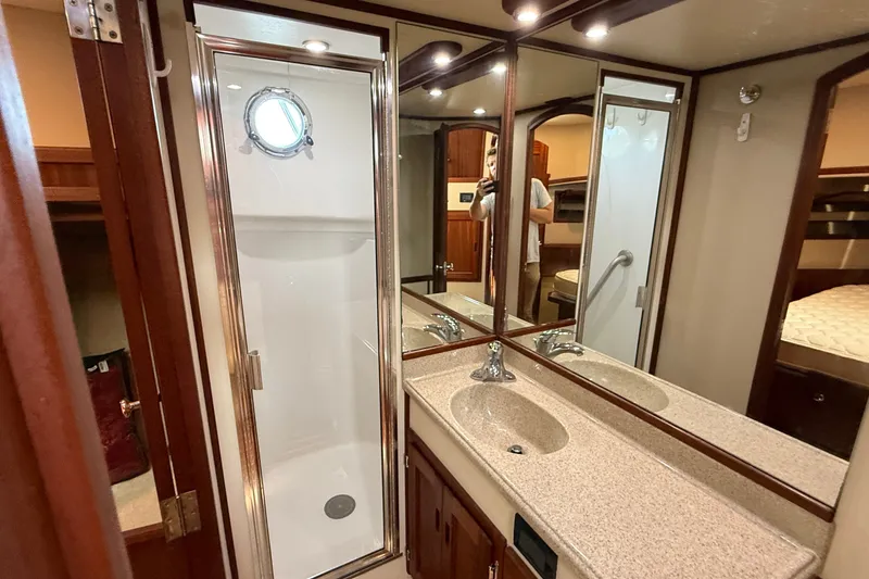 Slide: The Image of Luxurious bathroom in 2012 American Tug 365 yacht with shower and vanity. - 127