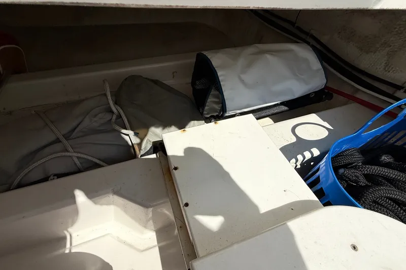 Slide: The Image of Storage compartment of a 2012 American Tug 365 with ropes and equipment. - 45