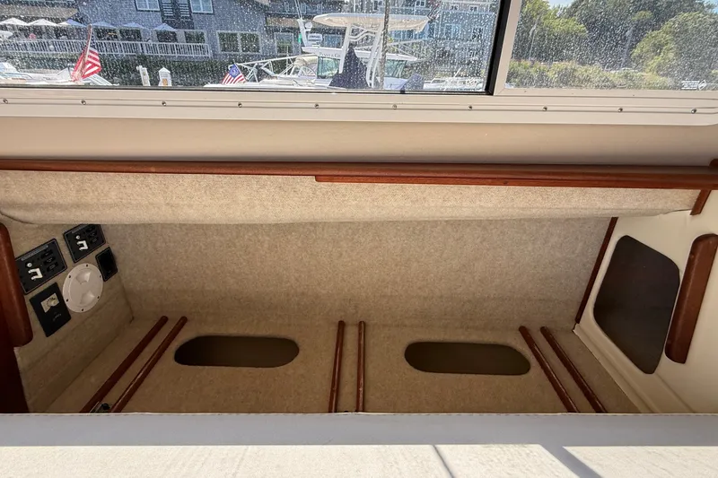 Slide: The Image of Interior view of 2012 American Tug 365 boat cabin with control panels. - 72