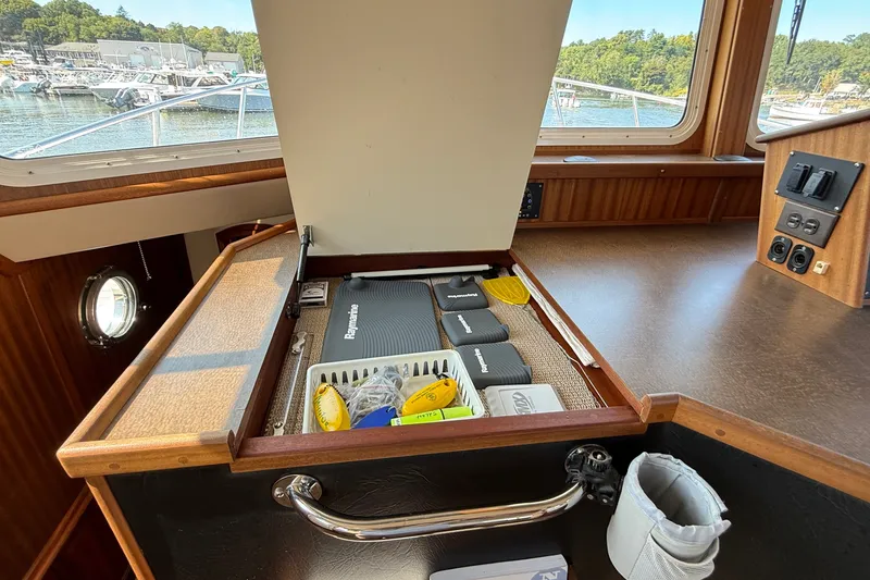 Slide: The Image of Interior view of 2012 American Tug 365 with open storage compartment. - 107