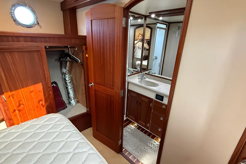 Slide: The Image of Interior of 2012 American Tug 365 featuring a cozy cabin with a bathroom. - 126