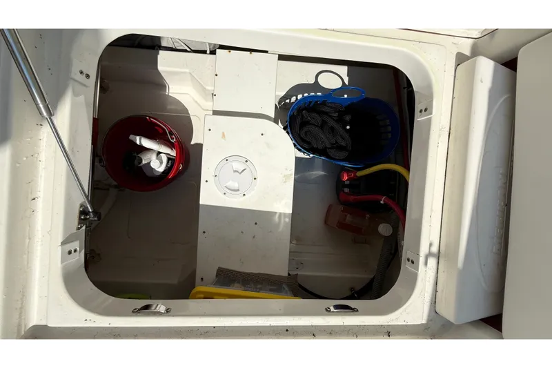Slide: The Image of Storage compartment of a 2012 American Tug 365 with various boating supplies. - 41