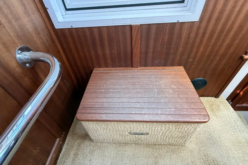 Slide: The Image of Interior of 2012 American Tug 365 with wooden step and metal railing. - 104