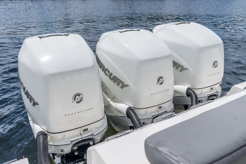Slide: The Image of Triple Mercury FourStroke engines on a 2011 Boston Whaler 370 Outrage boat. - 58