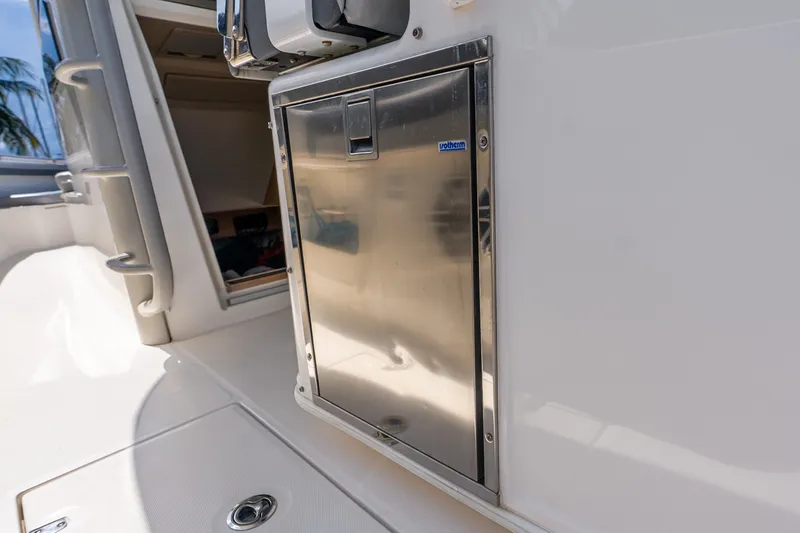 Slide: The Image of Stainless steel compartment on 2011 Boston Whaler 370 Outrage boat interior. - 38