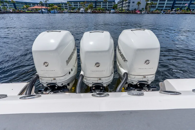 Slide: The Image of Triple Mercury outboard engines on a 2011 Boston Whaler 370 Outrage boat. - 57