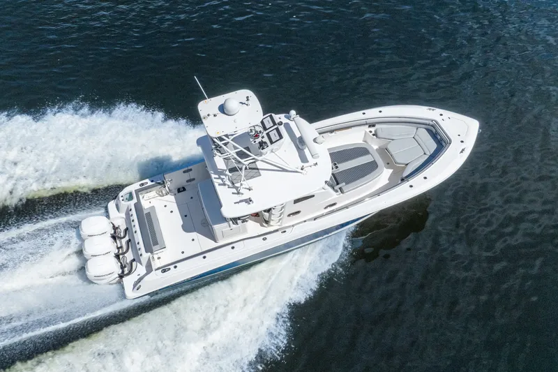 Slide: The Image of 2011 Boston Whaler 370 Outrage cruising on open water, aerial view. - 20