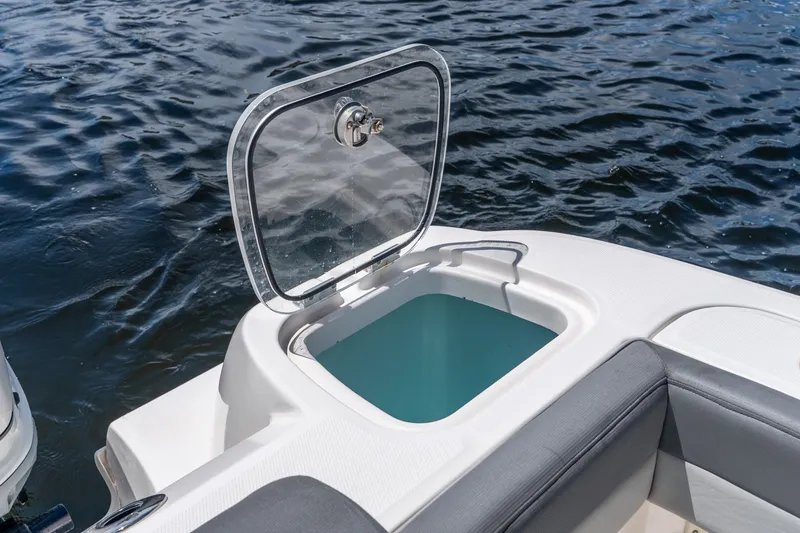 Slide: The Image of Open hatch on 2011 Boston Whaler 370 Outrage boat, revealing storage compartment. - 34