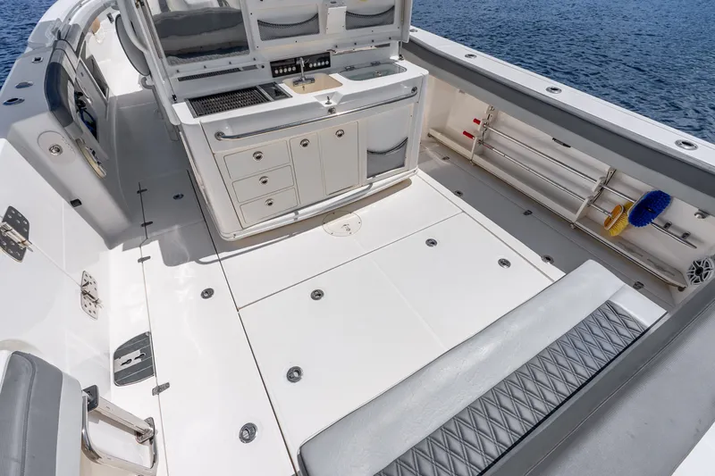 Slide: The Image of 2011 Boston Whaler 370 Outrage boat deck with seating, storage, and ocean view. - 22