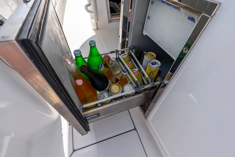 Slide: The Image of Beverage cooler on 2011 Boston Whaler 370 Outrage, stocked with assorted drinks. - 37