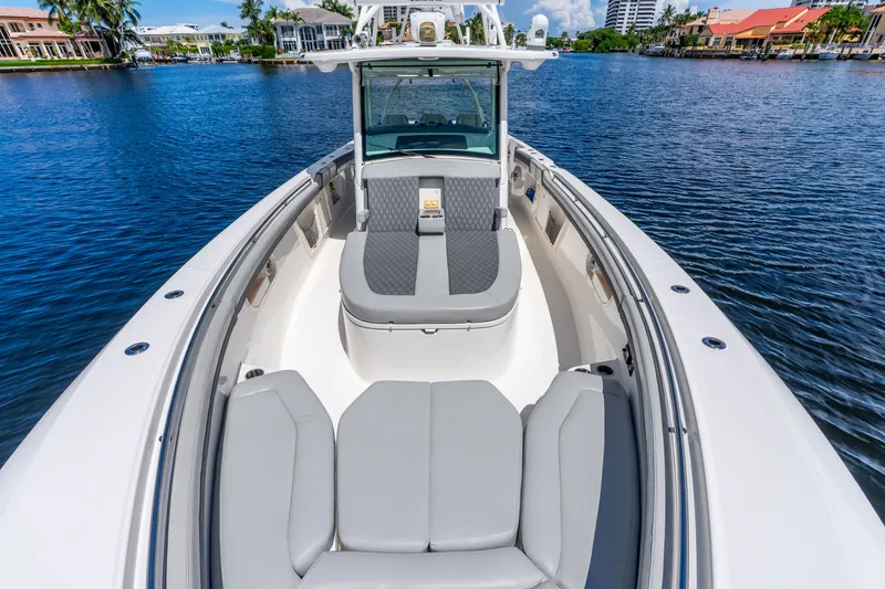 Slide: The Image of 2011 Boston Whaler 370 Outrage boat with spacious seating on calm water. - 49