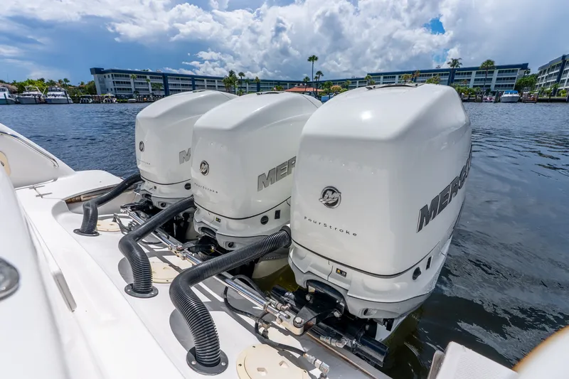 Slide: The Image of Triple Mercury outboard engines on a 2011 Boston Whaler 370 Outrage boat. - 56