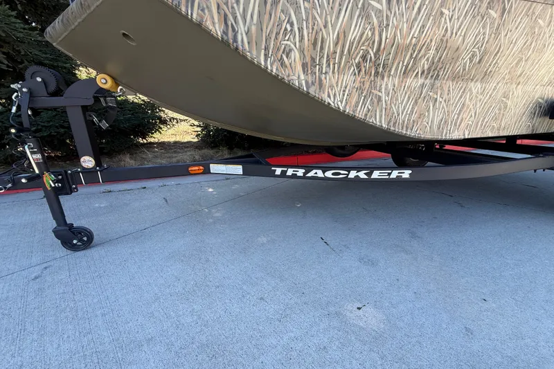 Slide: The Image of 2027 Tracker Grizzly 1553 Timber boat trailer on concrete surface. - 16