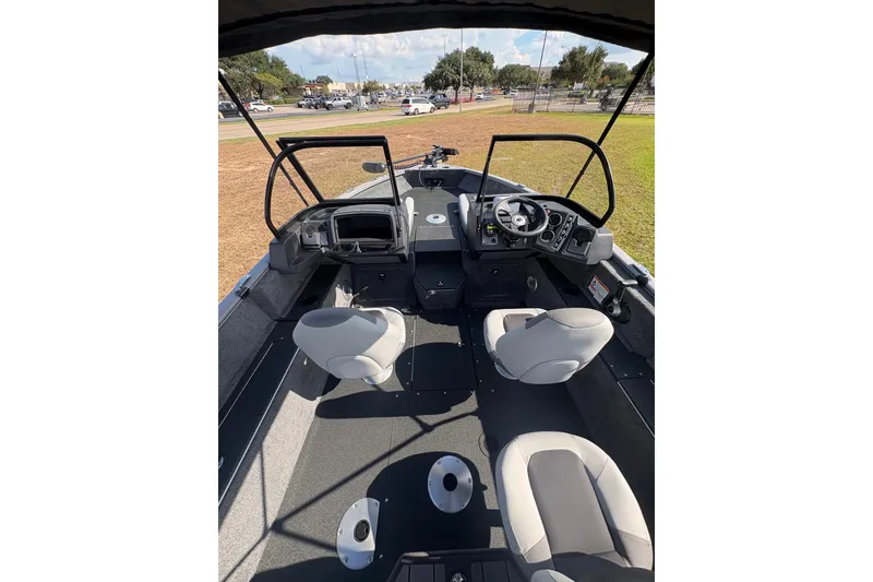 Slide: The Image of Interior view of 2027 Tracker Pro Guide V-175 Combo boat with seating and steering console. - 28