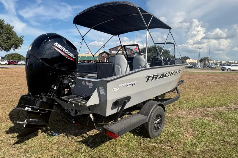 Slide: The Image of 2027 Tracker Pro Guide V-175 Combo boat with Mercury engine on grassy field. - 24