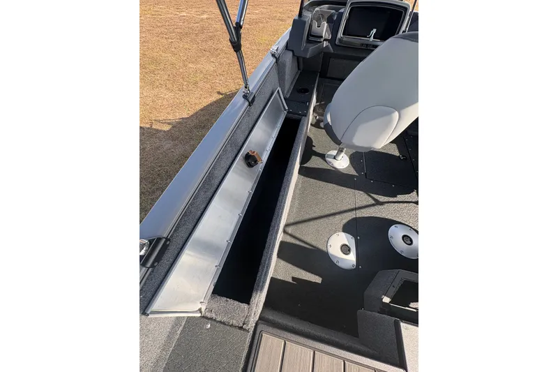 Slide: The Image of 2027 Tracker Pro Guide V-175 Combo boat interior with open storage compartment. - 36