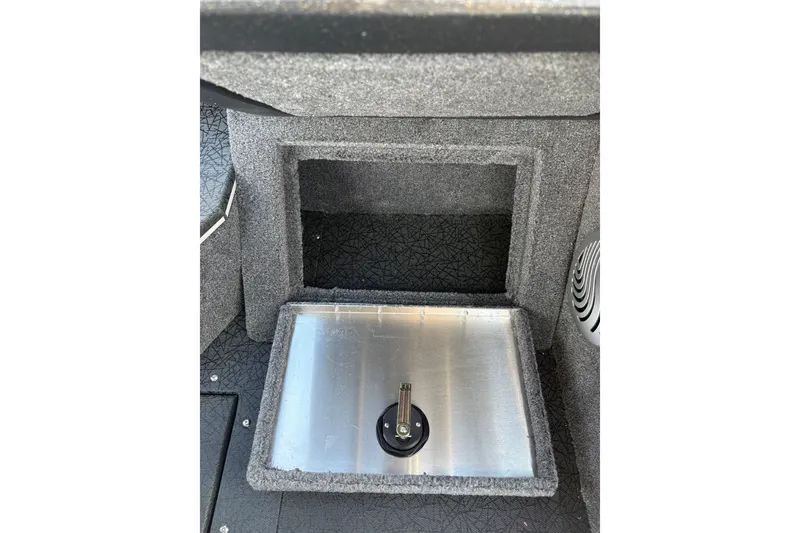 Slide: The Image of Storage compartment in 2027 Tracker Pro Guide V-175 Combo boat, featuring a secure latch. - 40