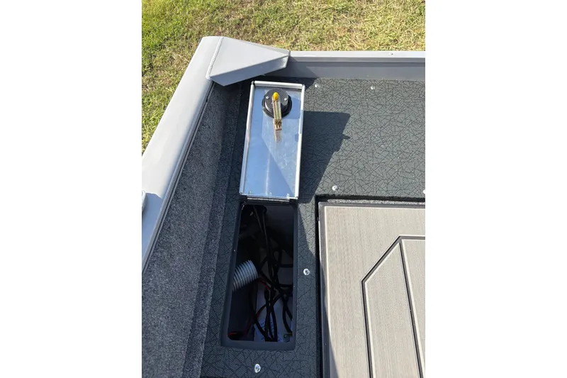 Slide: The Image of 2027 Tracker Pro Guide V-175 Combo boat interior with storage compartment and wiring. - 15