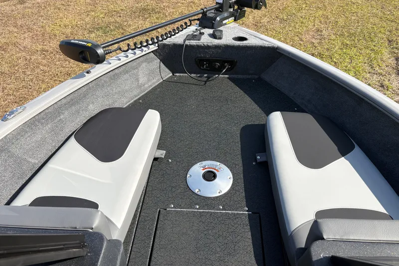 Slide: The Image of 2027 Tracker Pro Guide V-175 Combo boat interior with seating and trolling motor. - 13