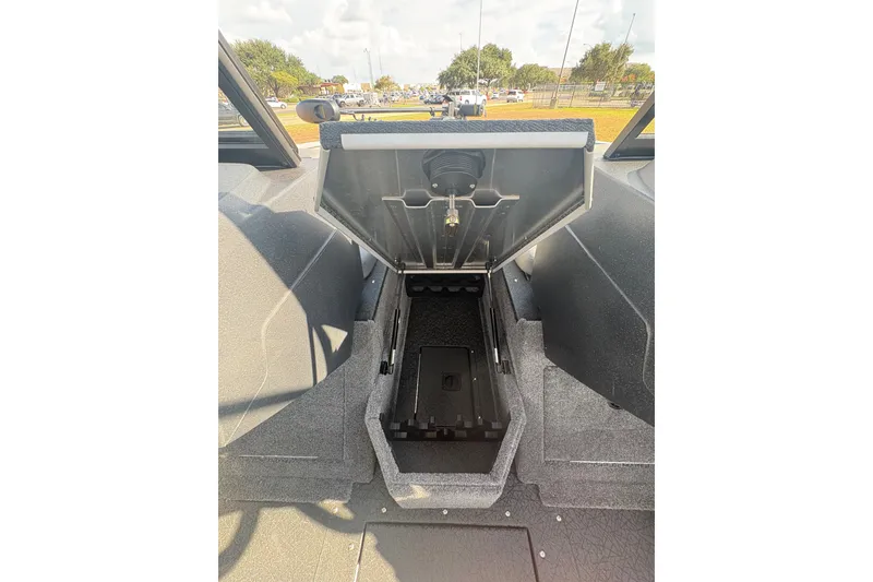 Slide: The Image of 2027 Tracker Pro Guide V-175 Combo boat interior storage compartment open. - 81