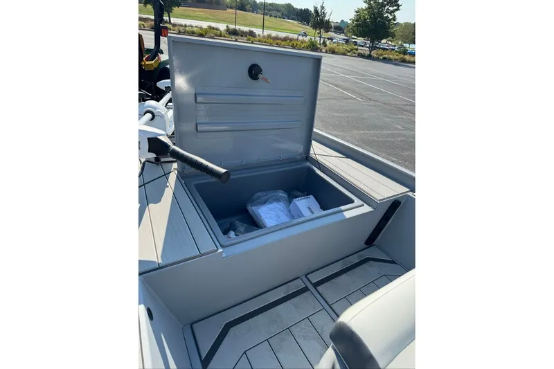 Slide: The Image of Open storage compartment on 2027 Tracker Bass Tracker Classic CC boat. - 14