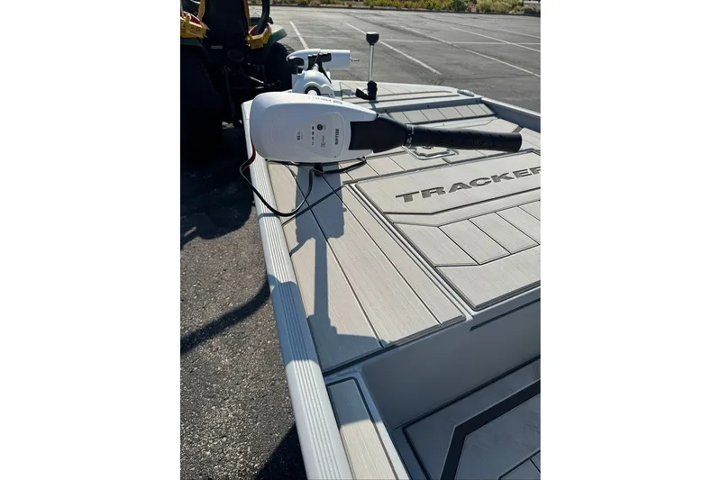 Slide: The Image of 2027 Tracker Bass Tracker Classic CC boat with motor in parking lot. - 15