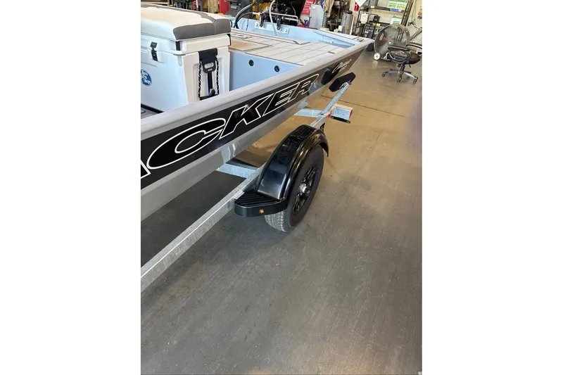 Slide: The Image of 2027 Tracker Bass Tracker Classic CC boat on trailer in showroom. - 13
