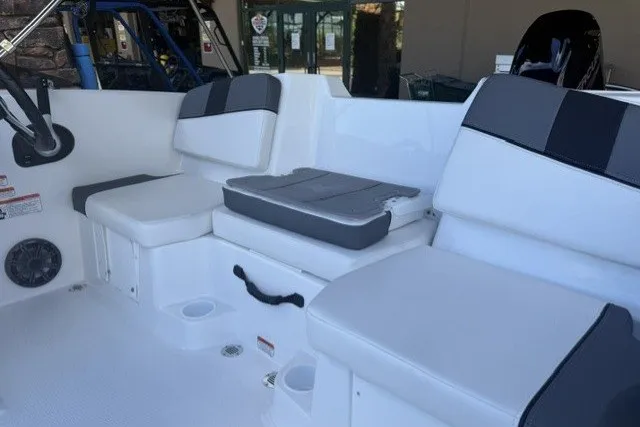 Slide: The Image of 2027 Tahoe T16 boat interior with cushioned seating and cup holders. - 8