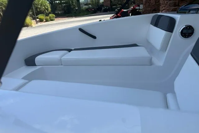 Slide: The Image of 2027 Tahoe T16 boat interior with white seating and modern design. - 14