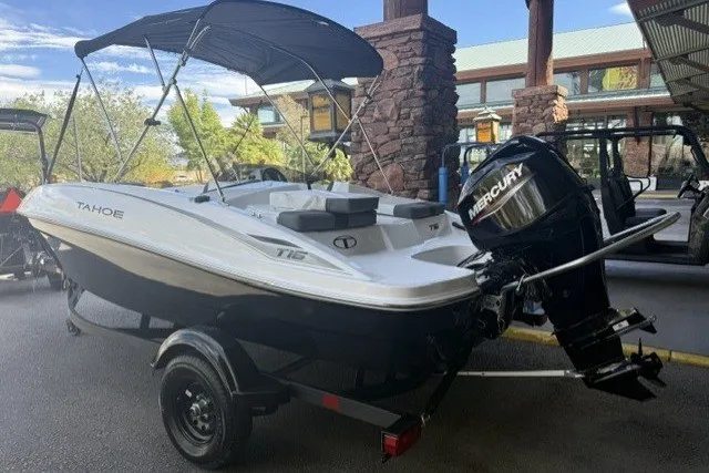 Slide: The Image of 2027 Tahoe T16 boat with Mercury engine on trailer, parked outdoors. - 3