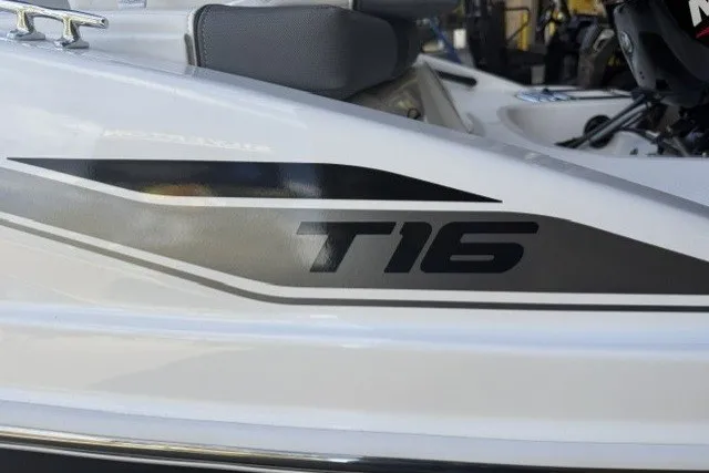 Slide: The Image of 2027 Tahoe T16 boat, sleek design with bold T16 branding on the side. - 4