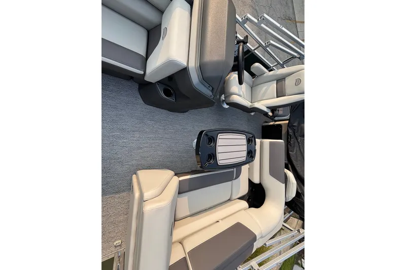 Slide: The Image of 2027 Sun Tracker Fishin' Barge 20 DLX interior with seating and table. - 17