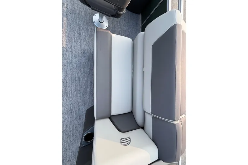 Slide: The Image of 2027 Sun Tracker Fishin' Barge 20 DLX interior seating, featuring gray and white upholstery. - 20
