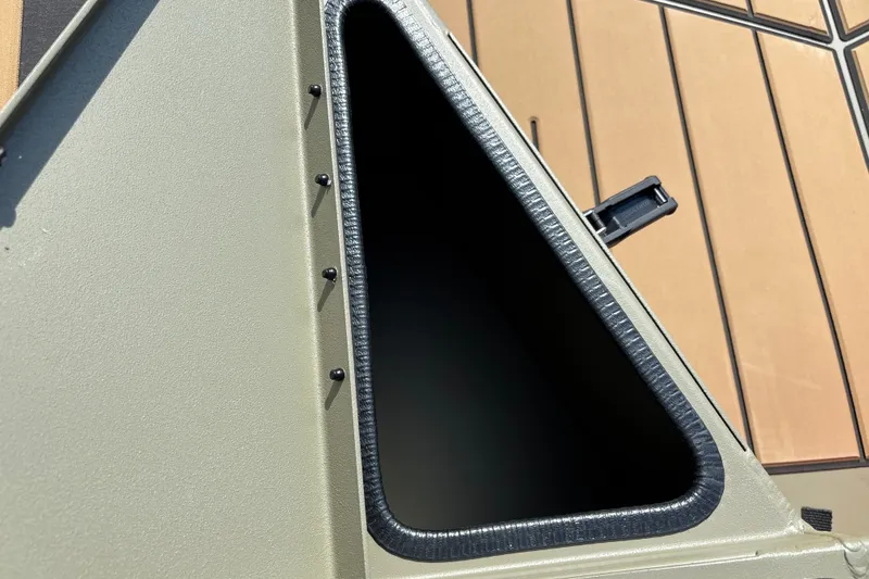 Slide: The Image of 2027 Tracker Grizzly 1553 Timber boat compartment with open hatch, showcasing interior details. - 20